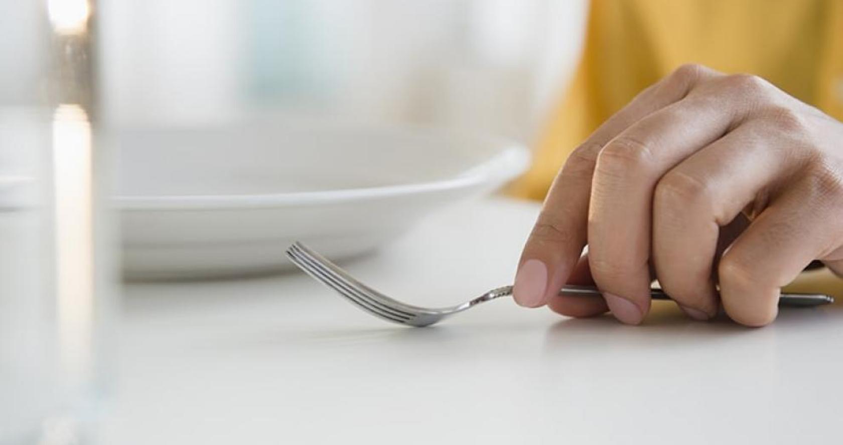 Hand with fork