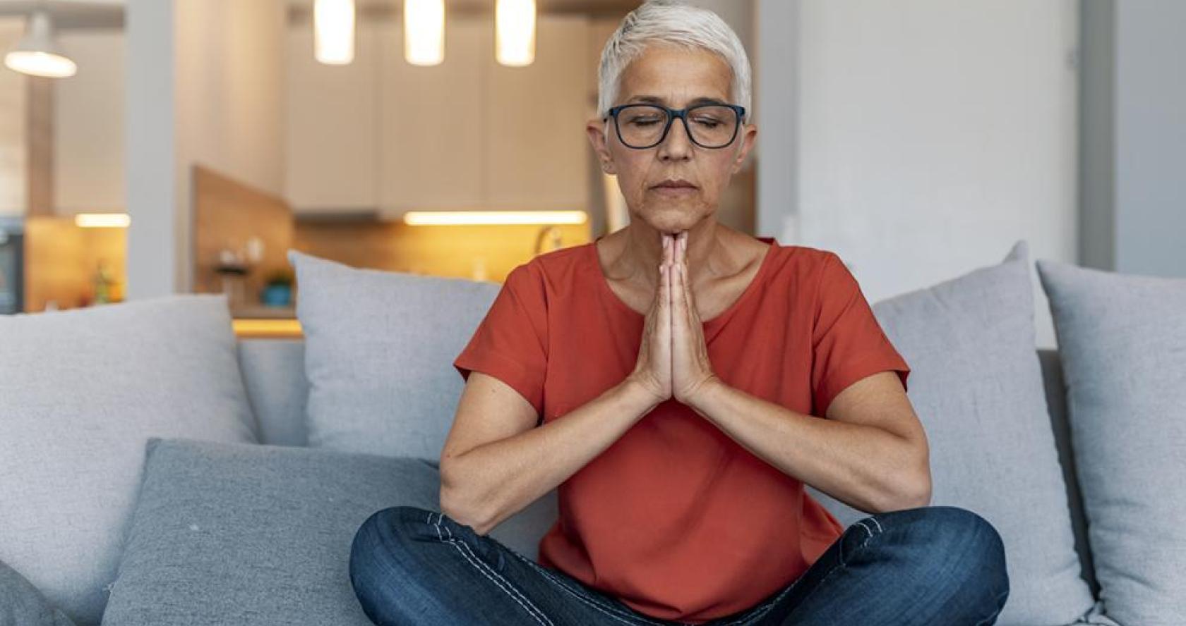 Older adult woman sitting on couch