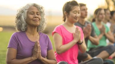 Older adults doing yoga outside