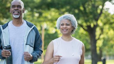 Older adult man and woman walking outside