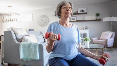 Older woman doing bicep curls